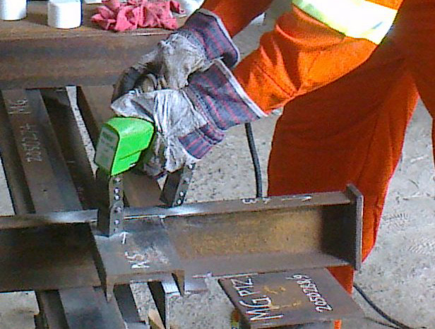 Magnetic particle inspection testing in progress